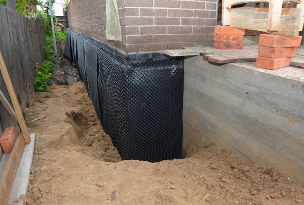 Happy homeowners after waterproofing job in Coral
